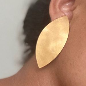 Yellow gold leaf metal statement clip on earrings